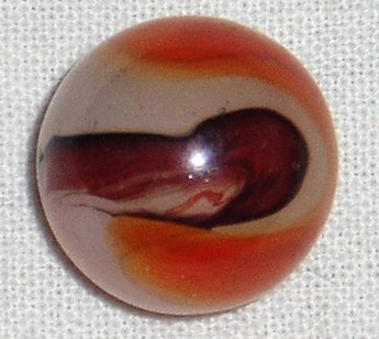 Picture of an Akro Agate carnelian oxblood marble.